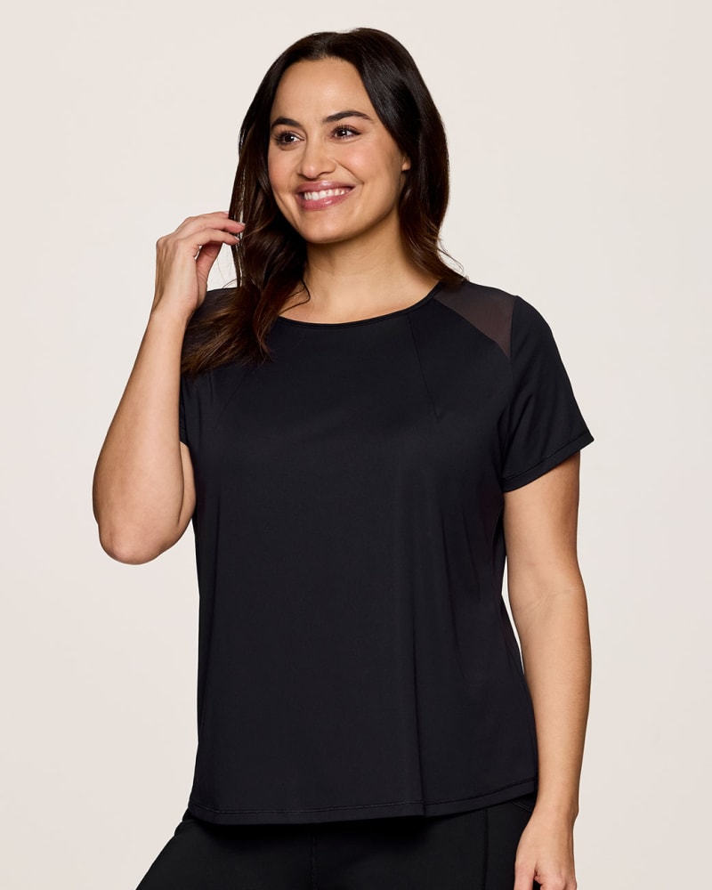 Front of a model wearing a size 1X Plus On The Run Tee in Black by RBX Active. | dia_product_style_image_id:347923